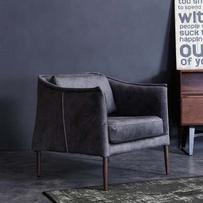 北欧休闲沙发椅子单人真皮沙发设计师沙发椅头层牛皮复古布艺单椅